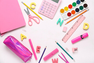 Frame made of different school stationery on white background