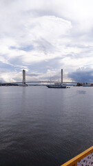Fototapeta premium Indonesia, Kendari: 05-31th 2025. Bahteramas Bridge with beautiful views of the bay in the day