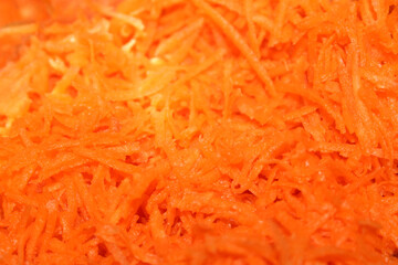 Grated Carrots Full Frame. Shredded Carrot Texture. Full Frame Carrot Grating.