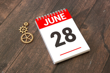 Wooden Calendar Showing the Date of June 28th.