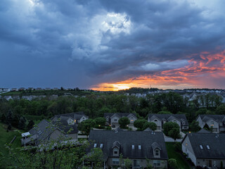Wide view of stormy sunset sky over a residential neighborhood near Pittsburgh