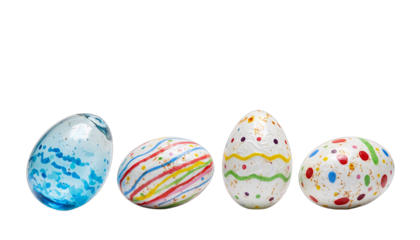 Four exquisite Easter eggs, blending glass and painted designs.