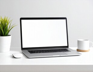 Fototapeta premium Minimalist workspace featuring laptop with blank screen plant and coffee mug on white desk