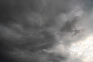Obraz premium Dramatic dark storm thundercloud rain clouds on black sky background. Dark thunderstorm clouds rainny landscape. Meteorology danger windstorm disaster climate. Dark cloudscape storm disaster gray sky