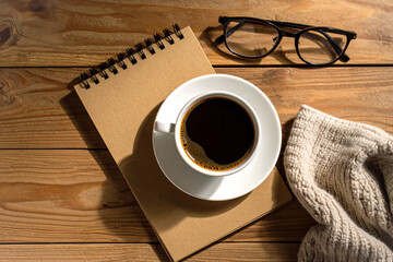 minimalist coffee setup on wooden table, cup of black coffee