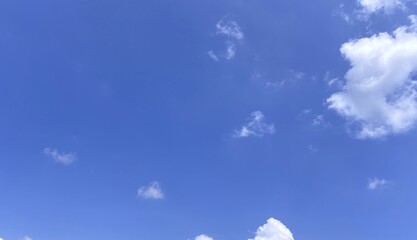 Azure sky with puffy clouds