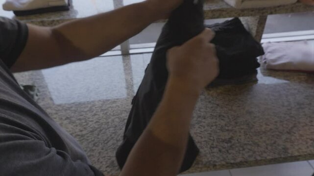 Folding clothes the at the laundry mat