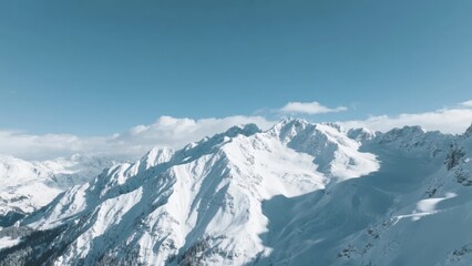 Snow-Capped Mountain Peaks Under a Clear Blue Sky