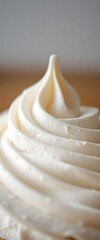 close up of a cupcake with white frosting