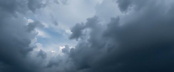 plane flying through a cloudy blue sky