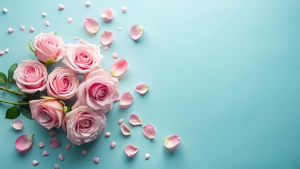 A Delicate Arrangement of Pink Roses and Petals on a Light Blue Background, Perfect for Romantic Occasions or Elegant Designs