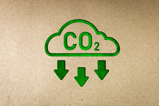 Green co2 reduction symbol on paper. Concept of carbon reduction campaign, zero greenhouse gas emissions, environmental protection, sustainable development. with copy space