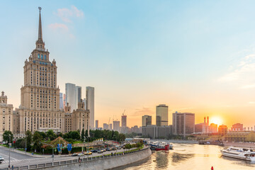Obraz premium High-rise stalinist building near river at summer sunset in Moscow, Russia. Historic name is Hotel Ukraine.