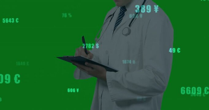 Male doctor writing on clipboard for monitoring floating currency data updating over green screen