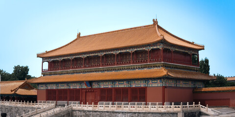 Majestic traditional Chinese imperial architecture within the historic Forbidden City (Palace Museum), Beijing. The grand building showcases characteristic yellow glazed tile roofs, vibrant red walls 