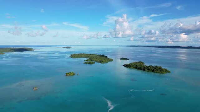 Maratua, Indonesia: Aerial drone footage of island inside the Maratua turquoise lagoon in the Derawan archipelago in Kalimantan in Indonesian Borneo. 