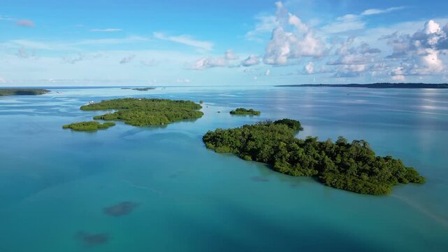 Maratua, Indonesia: Aerial drone footage of island inside the Maratua turquoise lagoon in the Derawan archipelago in Kalimantan in Indonesian Borneo. 