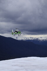 helicopter coming in for a landing on a glacier in Alaska © Jeff
