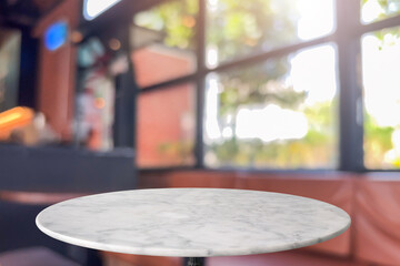 Round marble table top with blurred kitchen cafe restaurant interior background