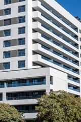 Detail of a modern white apartment complex seen in Badalona, Spain