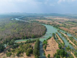 Scenic aerial view of Buon Don district in Dak Lak province, Vietnam showcasing winding rivers and lush green landscapes