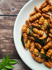 Kuih siput homemade close up. Traditional popular snack with copy space background. Stock photo.