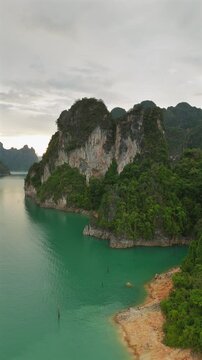 Experience stunning aerial views of turquoise waters and limestone hills in Phuket, Thailanda tropical paradise for travel enthusiasts seeking unique adventures and natural beauty