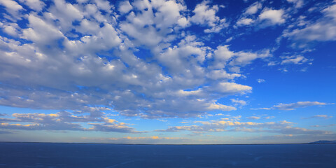 Dramatic blue sky with fluffy clouds over Bonneville salt flats wide angle shot in Utah