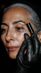 Woman applying cosmetic, close-up