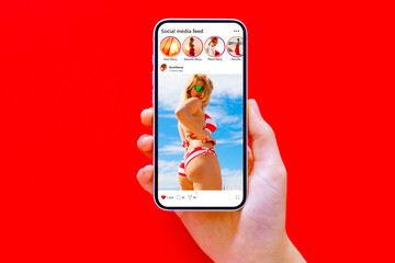 Sample social media posts on mobile phone, red background