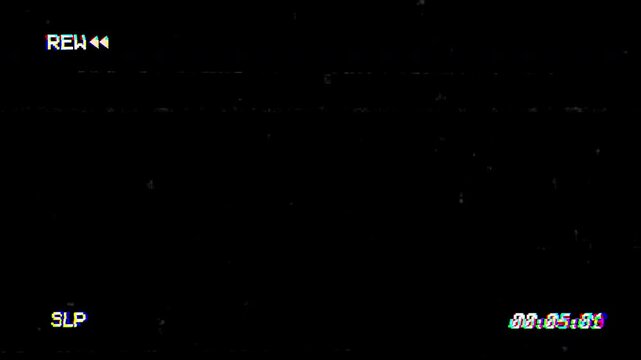 Rew Videocassette recorder (VCR) glitch of old damaged tape on black background. 4K Video
