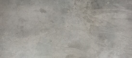 Naklejka premium Distressed Gray Concrete Wall with Subtle Patches and Stains