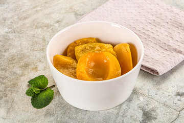 Canned marinated peach in syrop