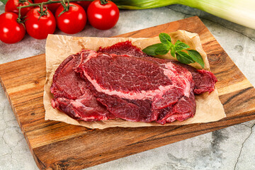 Raw beef cheeks cut for cooking