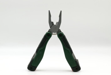 Multi tool with multiple functions and pliers on white background.