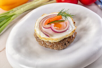 Beefsteak chop with roasted egg