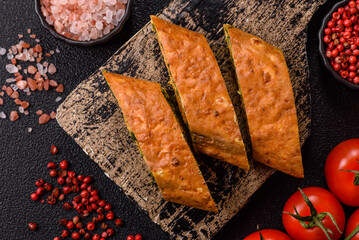 Roll of omelette, spinach, cheese and minced meat