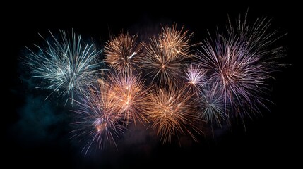 Spectacular colorful fireworks explosion lighting up the night sky with vibrant bursts and glowing trails