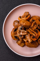 Food, baked mushrooms champignon slices with sauce and spices