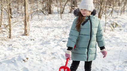 Little girls having fun on snowy winter day