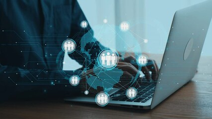 Individual using a laptop at a wooden desk, surrounded by digital icons representing global connectivity and networking for modern business solutions. Qubit - Powered by Adobe