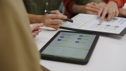 Asian financial consultant explaining investment insurance to  couple using a laptop at home.financial planning for future goals.