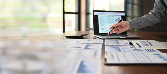 business analyst analyzing operating results from business and financial report. Concept of business planning ,accounting, business analysis,financial planning,data analysis.