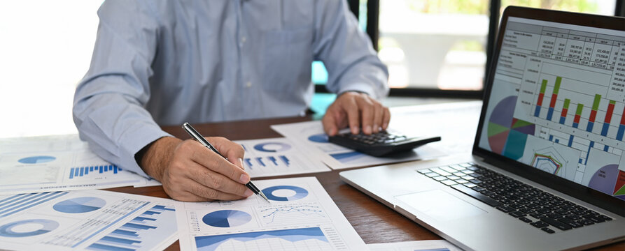 business analyst analyzing operating results from business and financial report. Concept of business planning ,accounting, business analysis,financial planning,data analysis.