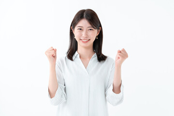 ガッツポーズをする女性