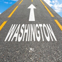 Fototapeta premium Road to washington: arrow pointing on asphalt highway with clear blue sky