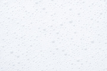 Fototapeta premium Closeup view of rich lather surface covered in shimmering spherical bubbles creating textured abstract canvas ideal for shampoo banners, soap commercials, skincare brand visuals