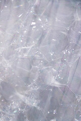 soap bubbles on white wall close-up for background or texture overlay
