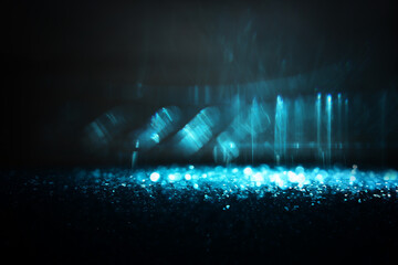 abstract glitter blue and black lights background. de-focused