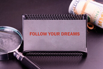 Follow your dreams motivational graduate education message. FOLLOW YOUR DREAMS written close-up on...